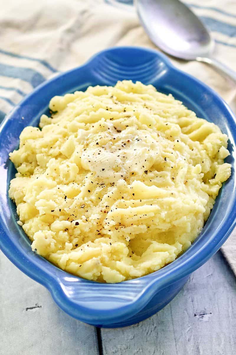 Instant Pot mashed potatoes with butter on top.