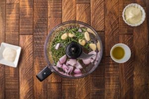 horseradish herb sauce ingredients in a food processor.