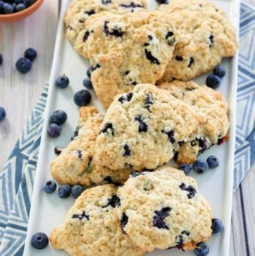 copycat Starbucks blueberry scones and a bowl of blueberries.