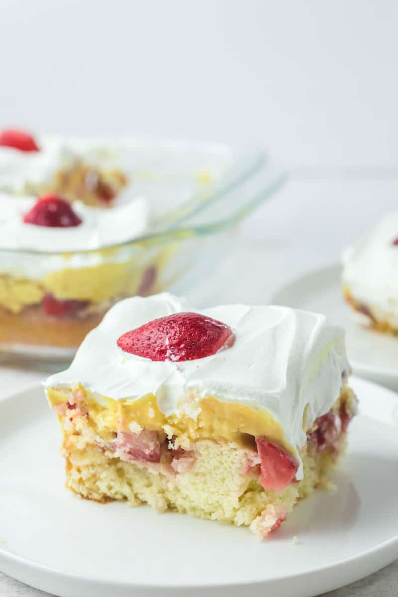 strawberry poke cake slice on a plate.