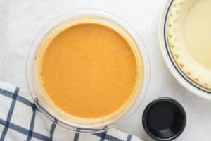 sugar free pumpkin pie filling mixture in a mixing bowl.