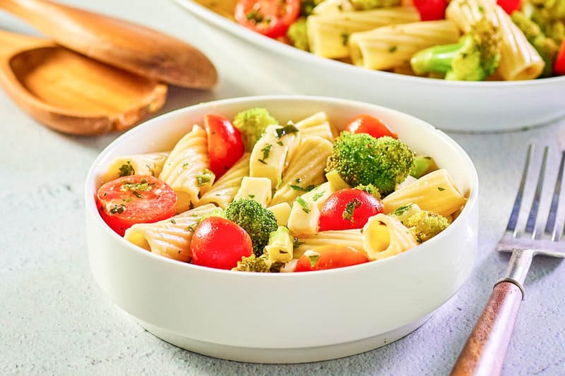 bowl of broccoli pasta salad and a fork.