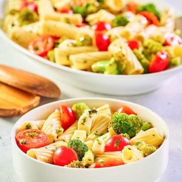 broccoli pasta salad in a bowl and on a large platter.