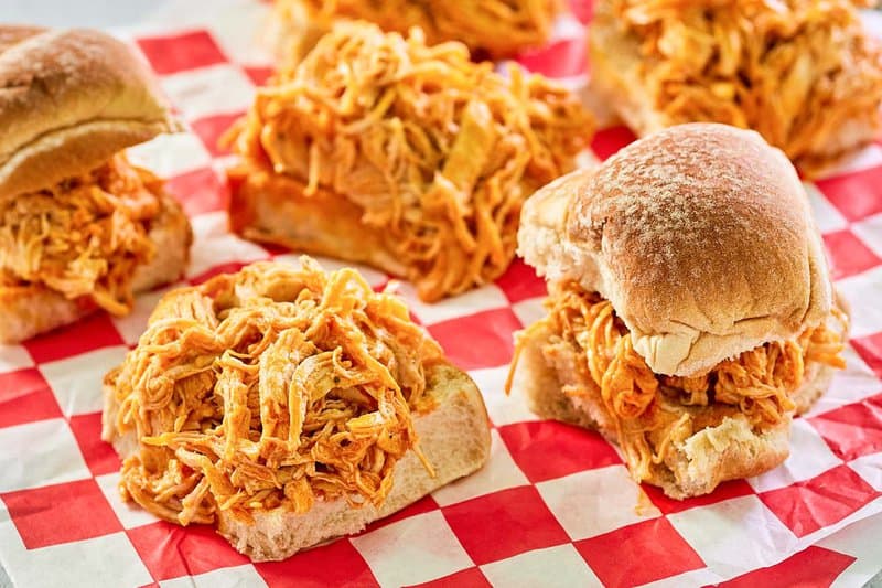 buffalo chicken sliders with and without top buns.