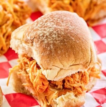 buffalo chicken slider on red checkered parchment paper.