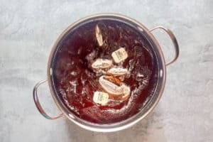 copycat chick fil a sweet tea brewing in a pan.