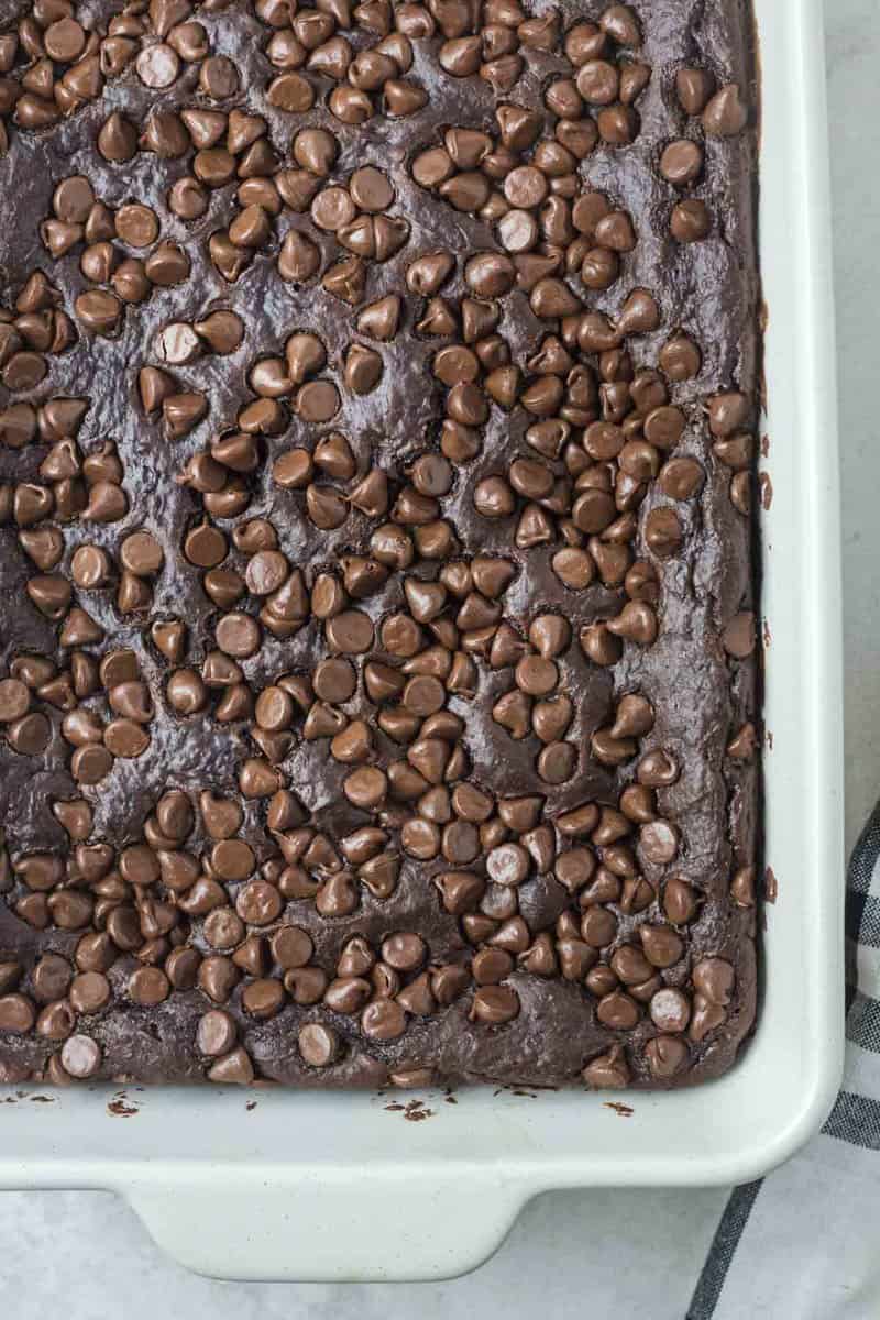overhead view of chocolate pudding cake with chocolate chips.