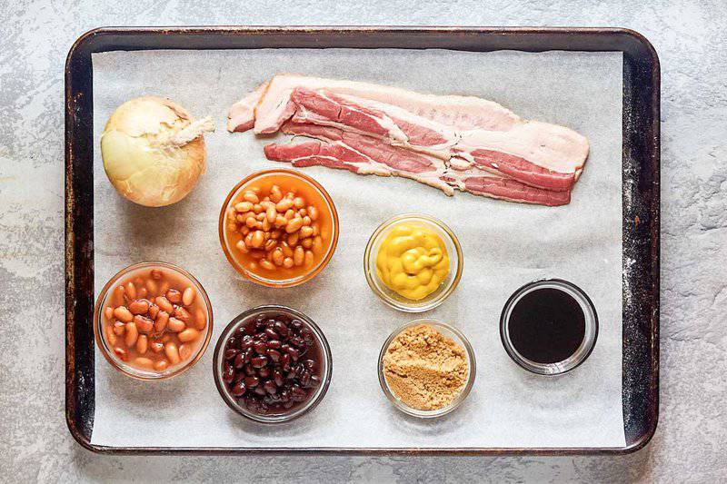 cracker barrel bacon baked beans ingredients on a tray.