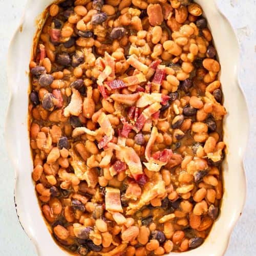 overhead view of copycat bacon baked beans in a serving dish.