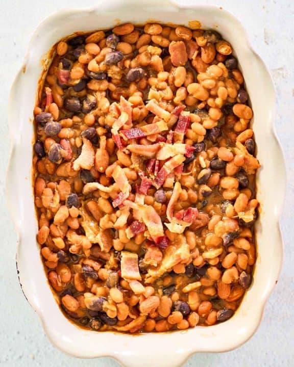 overhead view of copycat bacon baked beans in a serving dish.