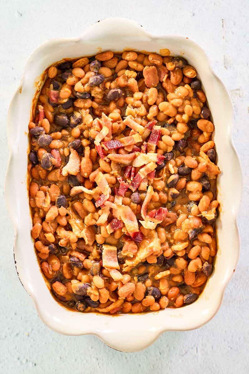 overhead view of copycat bacon baked beans in a serving dish.