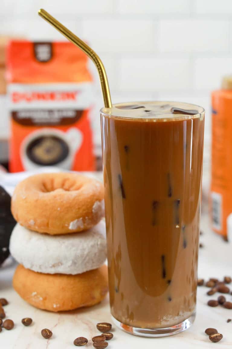 copycat Dunkin Donuts caramel iced coffee, donuts, and bag of coffee.