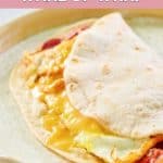 copycat Dunkin wake up wrap with bacon, egg, and cheese on a plate.