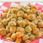 fried okra in a basket linked with parchment paper.