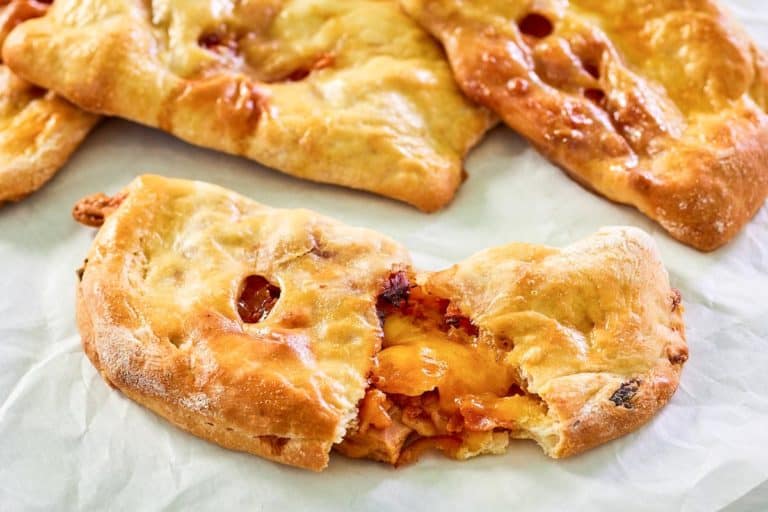 Homemade ham and cheese hot pockets baked until golden.