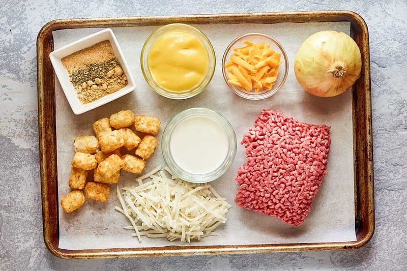 hamburger hashbrown casserole ingredients on a tray.