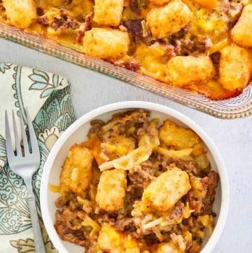 overhead view of hamburger hashbrown casserole in a baking dish and bowl.