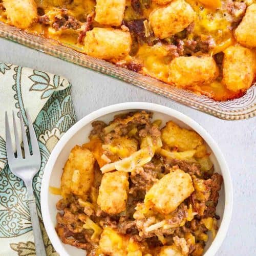 overhead view of hamburger hashbrown casserole in a baking dish and bowl.