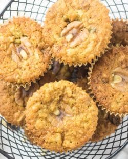 oatmeal raisin muffins with walnuts and coconut in a basket.