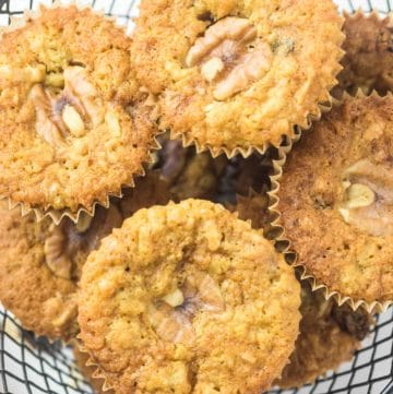 oatmeal raisin muffins with walnuts and coconut in a basket.