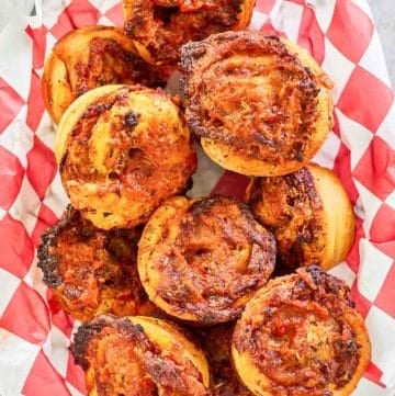 overhead view of homemade pizza rolls in a bread basket.