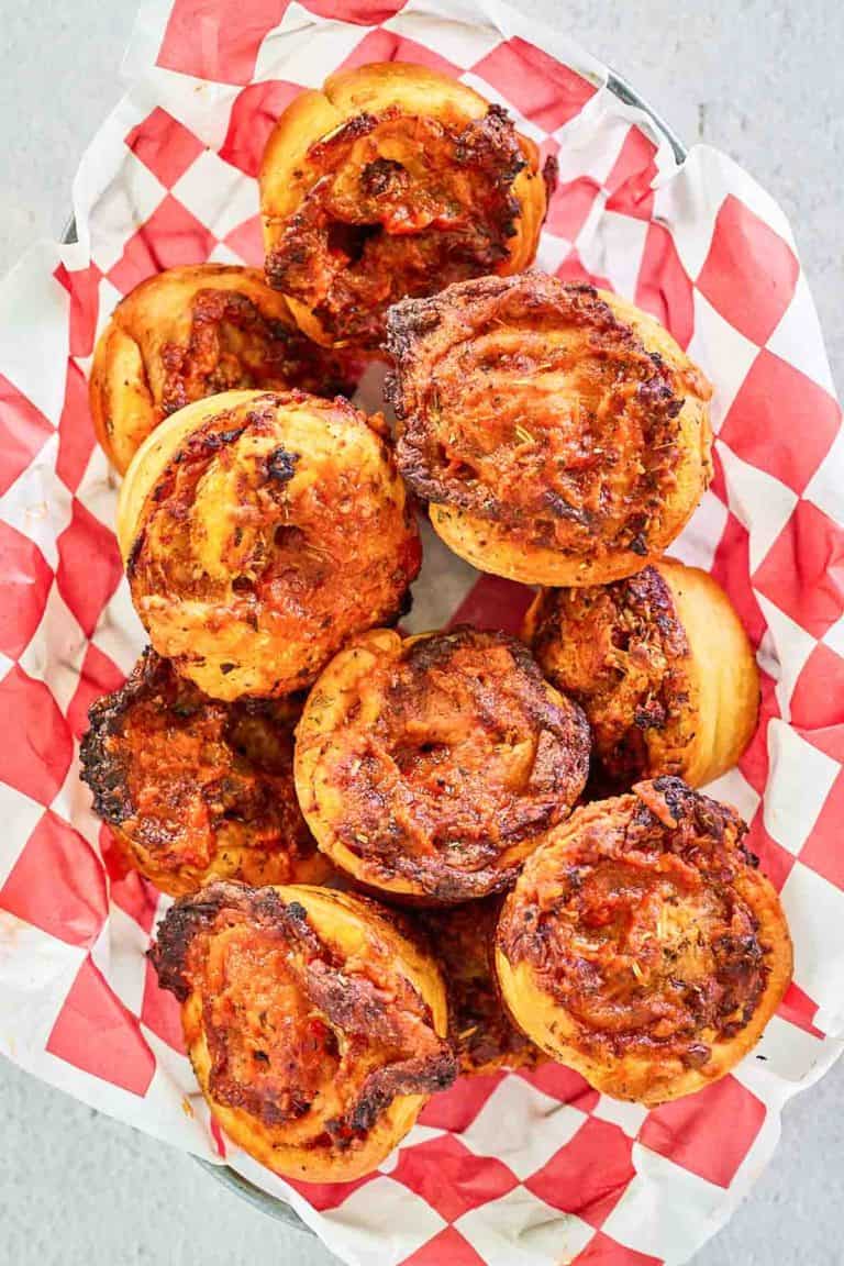 overhead view of homemade pizza rolls in a bread basket.