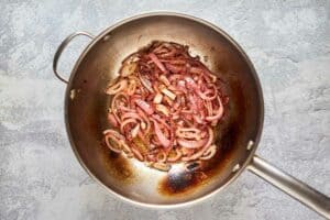 caramelized red onions in a pan.