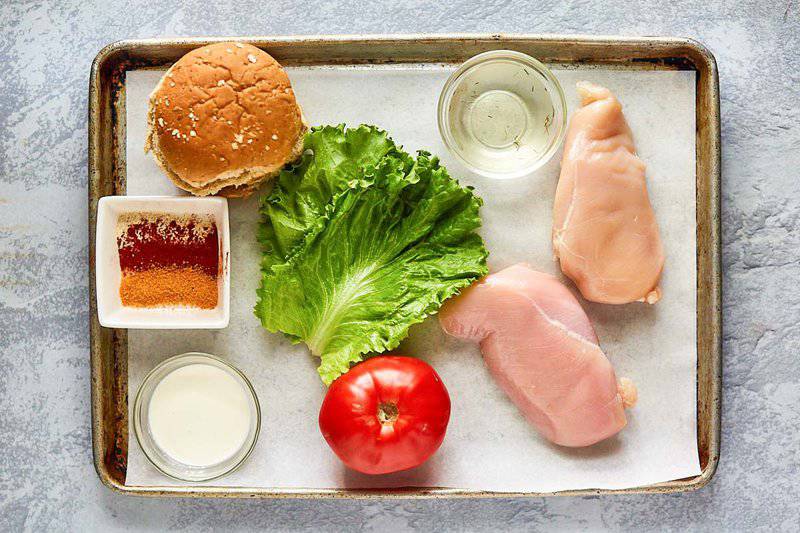 Chick Fil A grilled chicken sandwich ingredients on a tray.