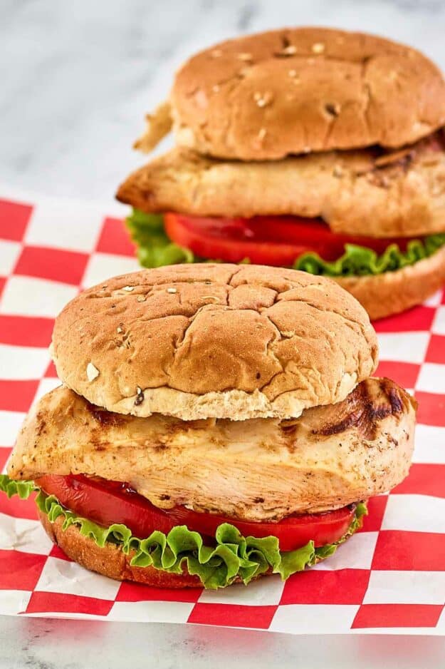two copycat Chick Fil A grilled chicken sandwiches.