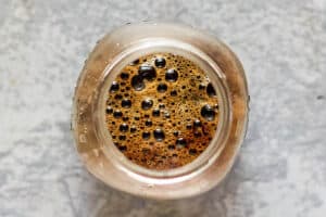 overhead view of cold brew coffee in a glass jar.