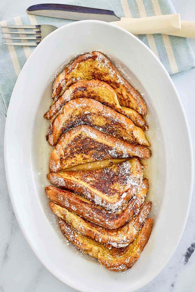 overhead view of copycat IHOP French Toast slices on a large plate.