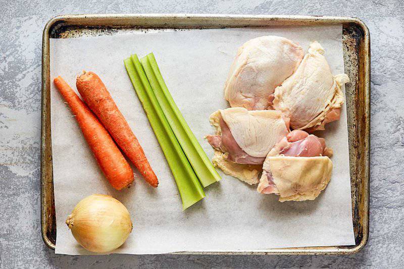 Instant Pot chicken broth ingredients on a tray.