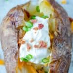 copycat Outback Steakhouse baked potato with toppings.