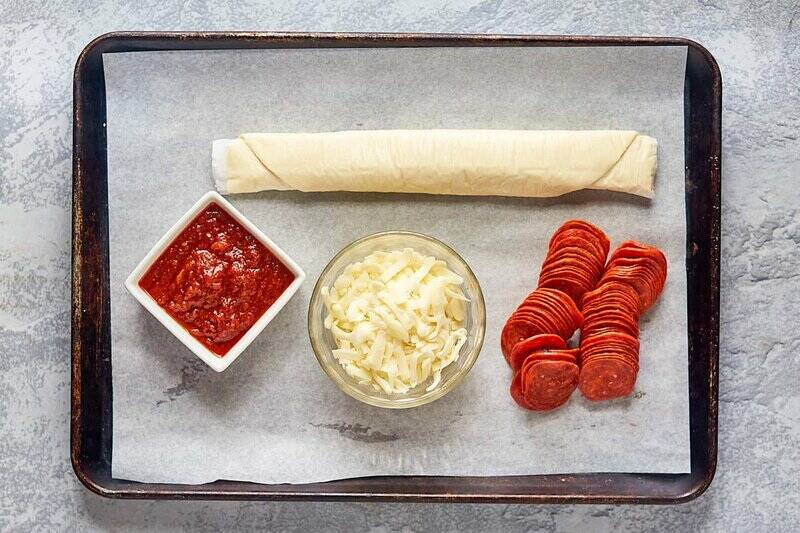 pepperoni hot pockets ingredients on a tray.