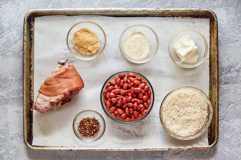 Popeyes red beans and rice ingredients on a tray.