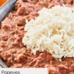 closeup of homemade Popeyes red beans and rice in a grey bowl.