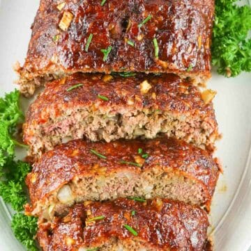 overhead view of smoked meatloaf on a platter.