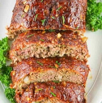 overhead view of smoked meatloaf on a platter.