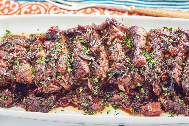 slices of stove top pot roast on a platter.