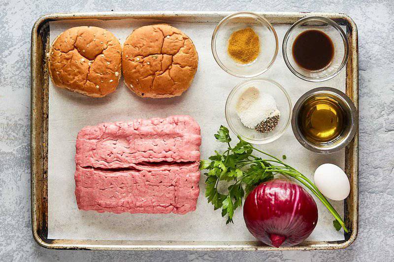 turkey burgers and caramelized red onions ingredients on a tray.