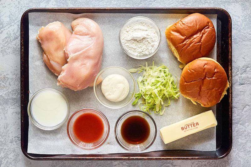 Arby's buffalo chicken sandwich ingredients on a tray.