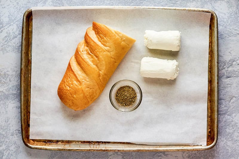 baked goat cheese ingredients on a tray.