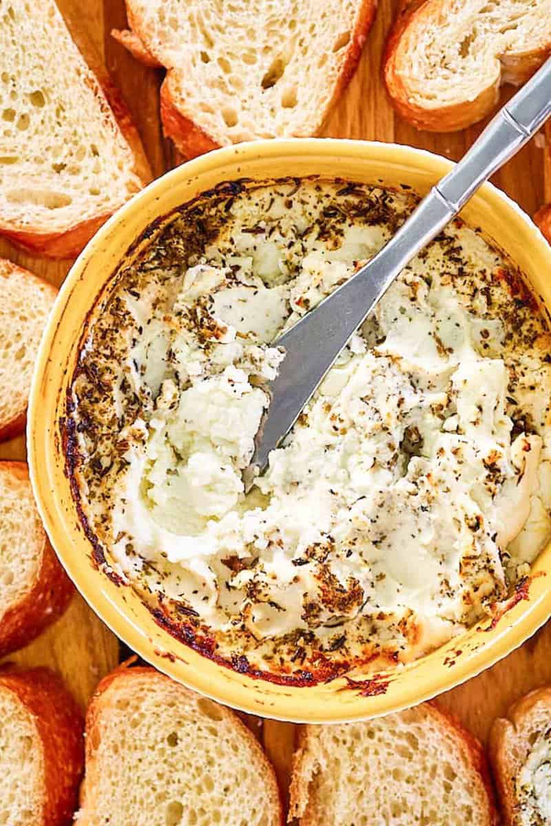 overhead view of Italian seasoned baked goat cheese.