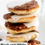 black and white cookies stacked on a plate.