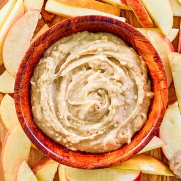 overhead view of caramel apple dip and apple slices around it.