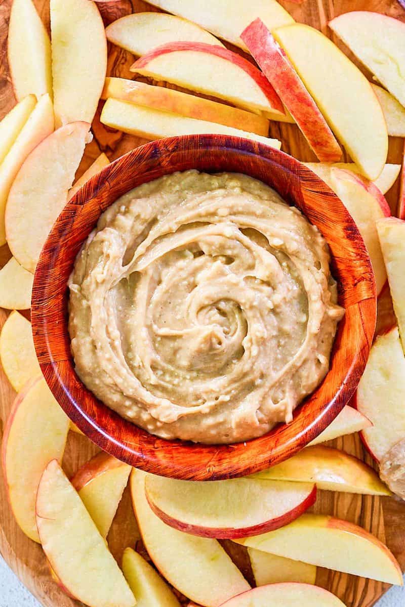 overhead view of caramel apple dip and apple slices around it.
