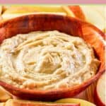 bowl of creamy caramel apple dip and apple slices.