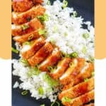 chicken katsu with sauce over rice.