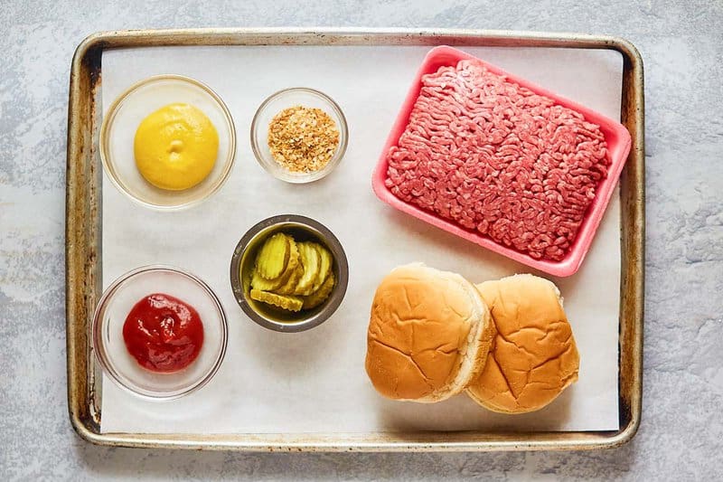 McDonald's hamburger ingredients on a tray.