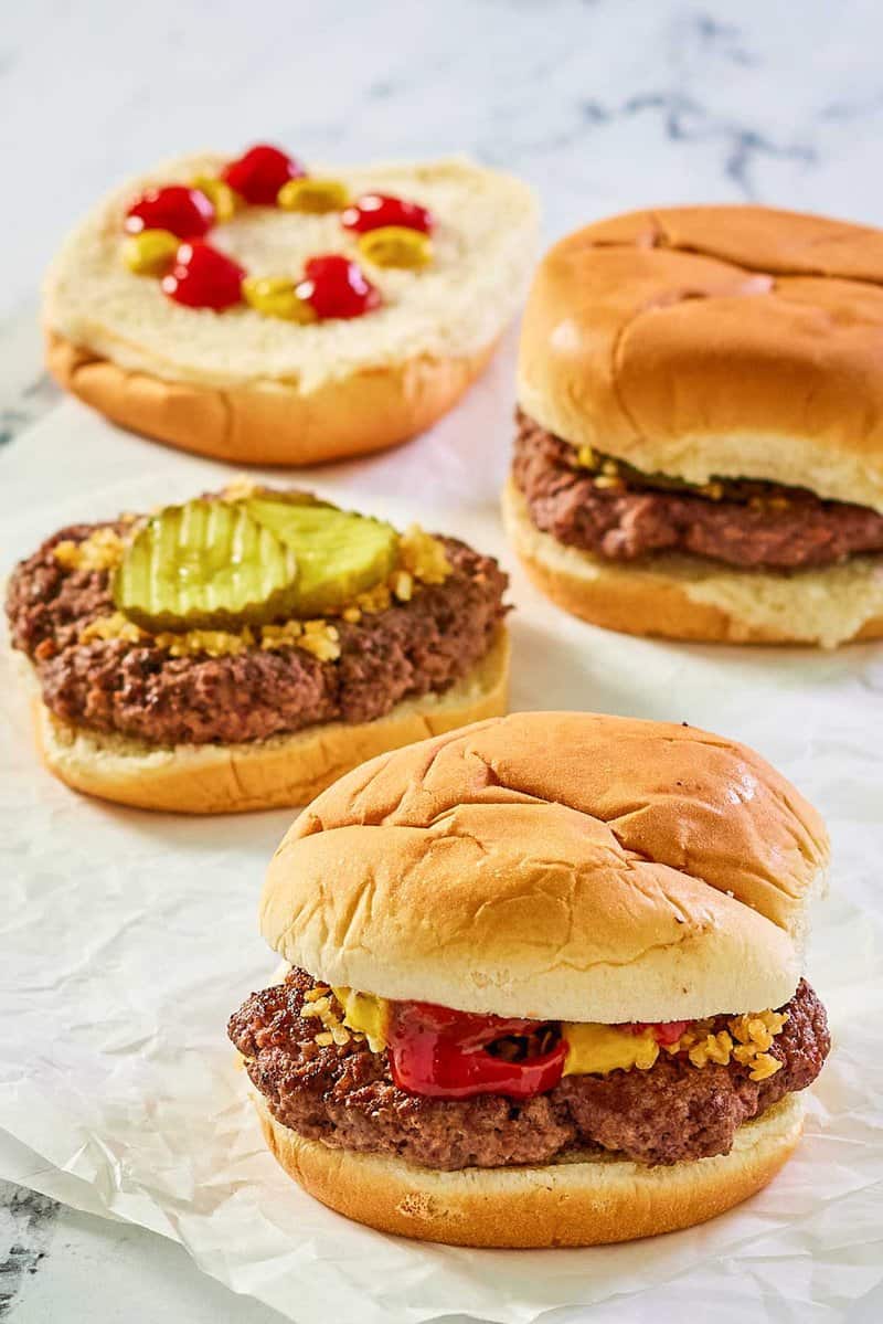 copycat McDonald's hamburgers on parchment paper.